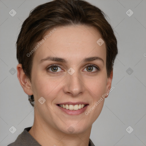 Joyful white young-adult female with short  brown hair and grey eyes