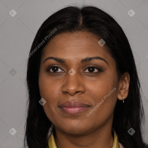 Joyful black young-adult female with long  brown hair and brown eyes