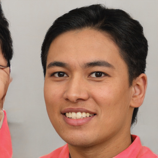 Joyful asian young-adult male with short  brown hair and brown eyes