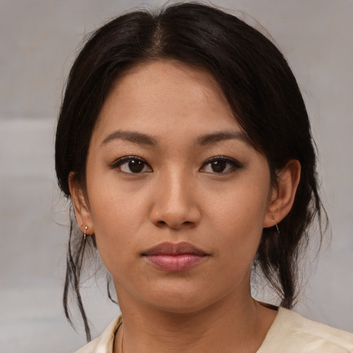 Neutral asian young-adult female with medium  brown hair and brown eyes