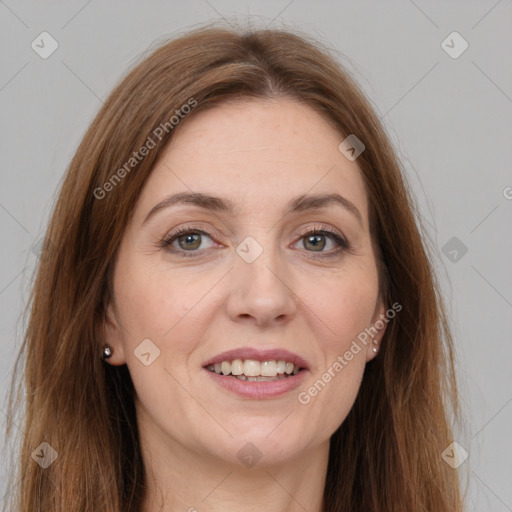 Joyful white adult female with long  brown hair and grey eyes