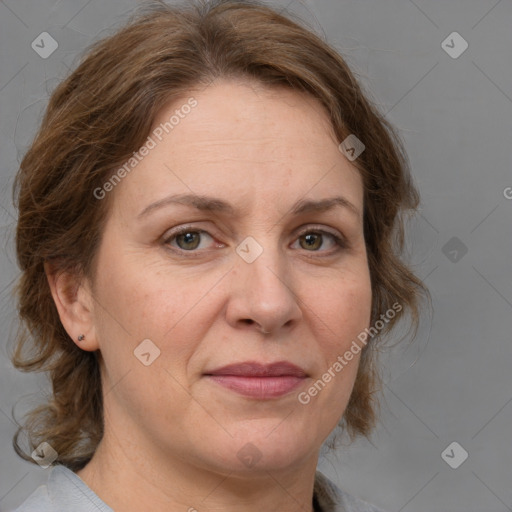 Joyful white adult female with medium  brown hair and grey eyes