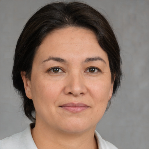 Joyful white adult female with medium  brown hair and brown eyes