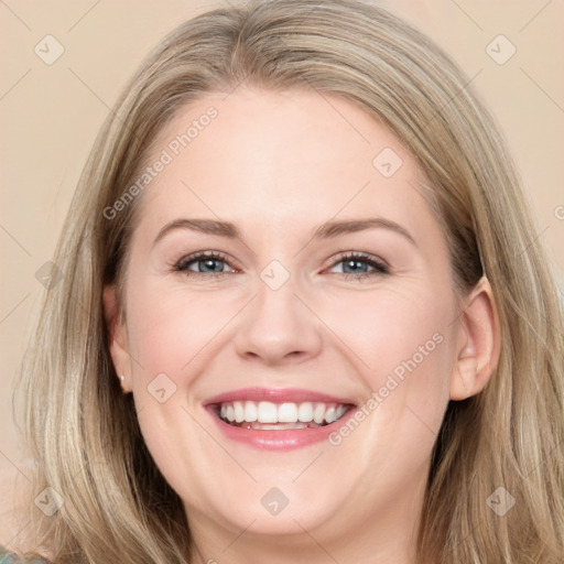 Joyful white young-adult female with long  brown hair and blue eyes