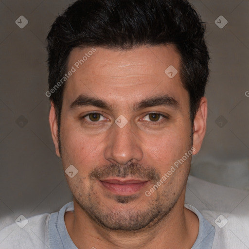 Joyful white adult male with short  brown hair and brown eyes