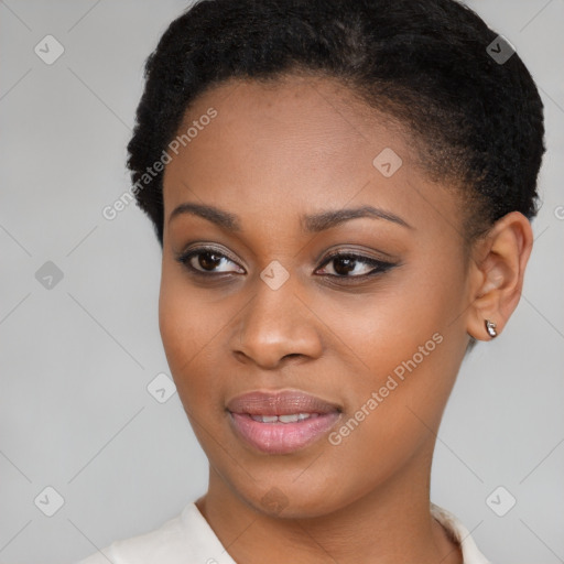 Joyful black young-adult female with short  brown hair and brown eyes