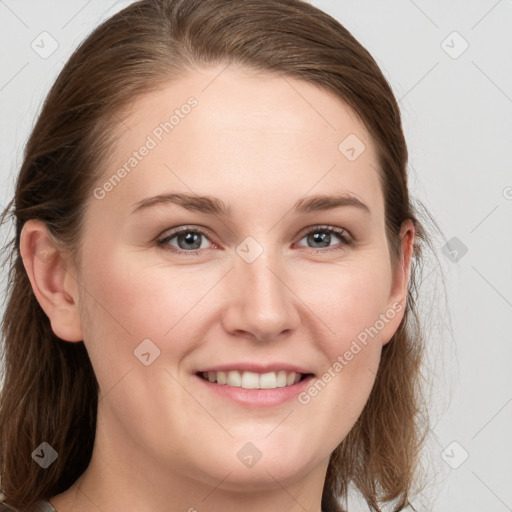 Joyful white young-adult female with medium  brown hair and blue eyes