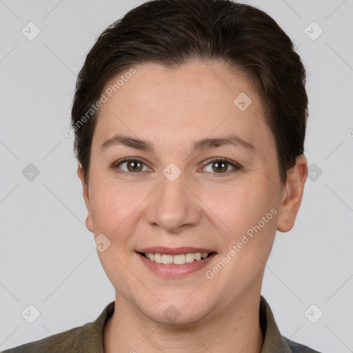 Joyful white adult female with short  brown hair and brown eyes