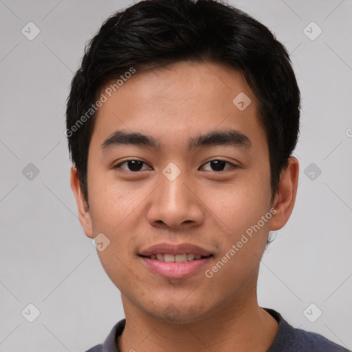 Joyful asian young-adult male with short  black hair and brown eyes