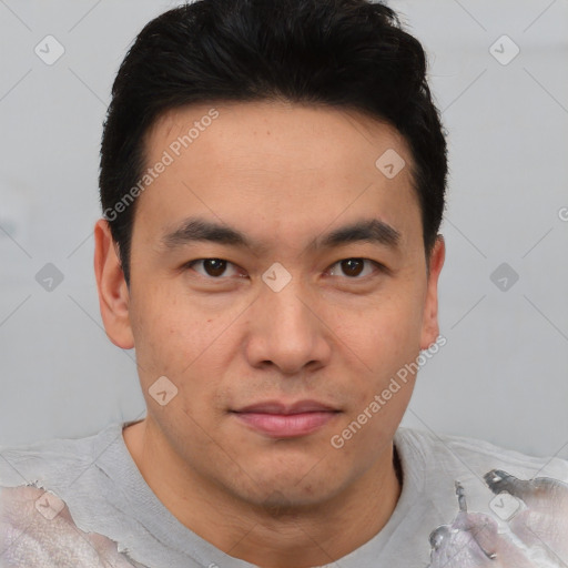 Joyful asian young-adult male with short  brown hair and brown eyes