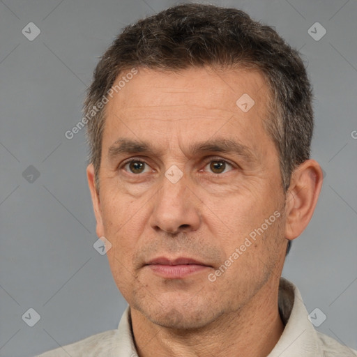 Neutral white middle-aged male with short  brown hair and brown eyes