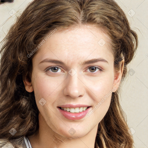 Joyful white young-adult female with long  brown hair and green eyes