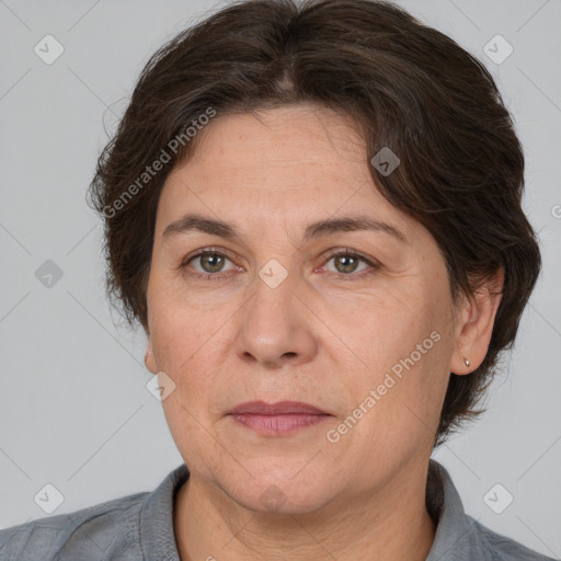 Joyful white adult female with short  brown hair and brown eyes