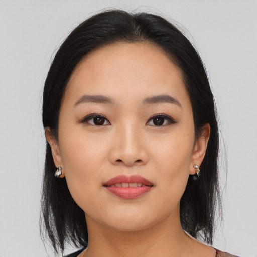 Joyful asian young-adult female with medium  black hair and brown eyes