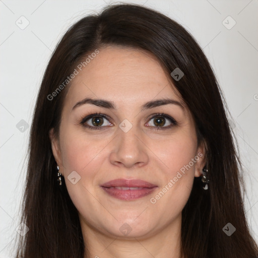 Joyful white adult female with long  brown hair and brown eyes