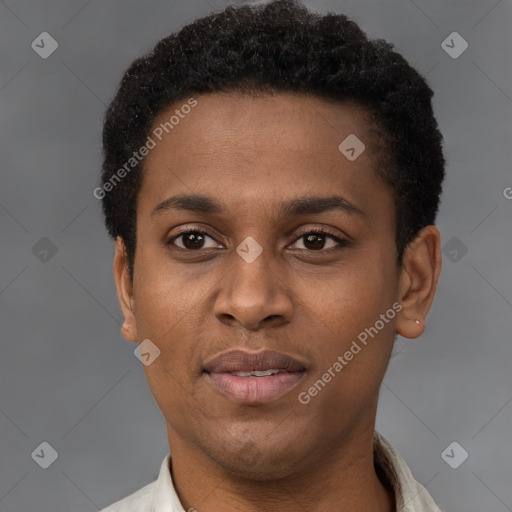 Joyful black young-adult male with short  brown hair and brown eyes