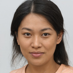 Joyful asian young-adult female with medium  brown hair and brown eyes