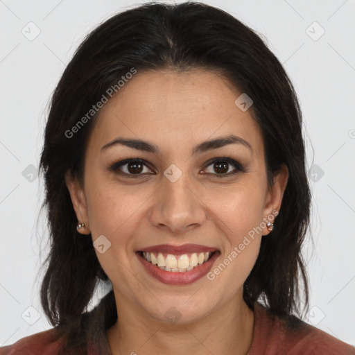 Joyful latino young-adult female with medium  brown hair and brown eyes