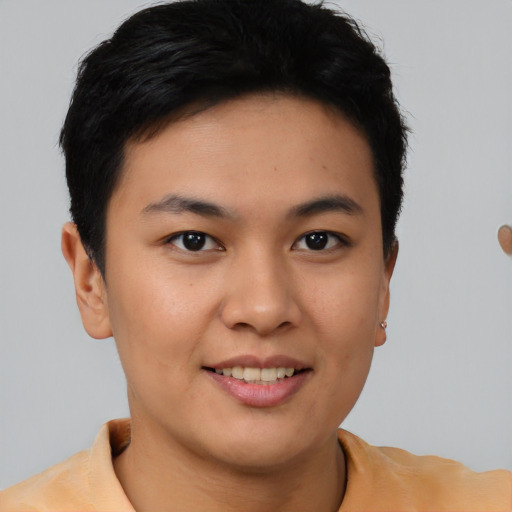 Joyful asian young-adult female with short  brown hair and brown eyes