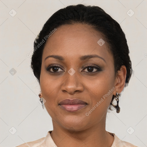 Joyful black adult female with short  black hair and brown eyes