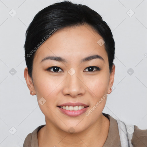 Joyful asian young-adult female with short  black hair and brown eyes