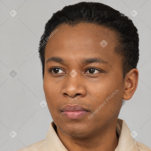 Joyful black young-adult male with short  black hair and brown eyes