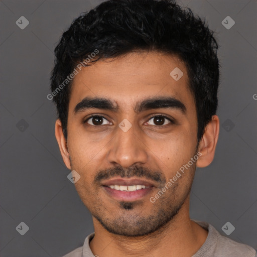 Joyful latino young-adult male with short  black hair and brown eyes