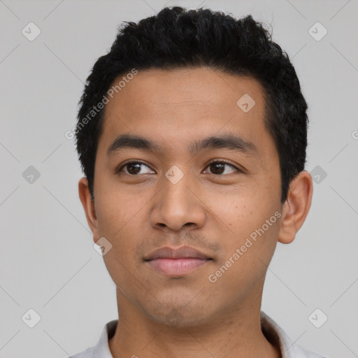 Neutral latino young-adult male with short  black hair and brown eyes