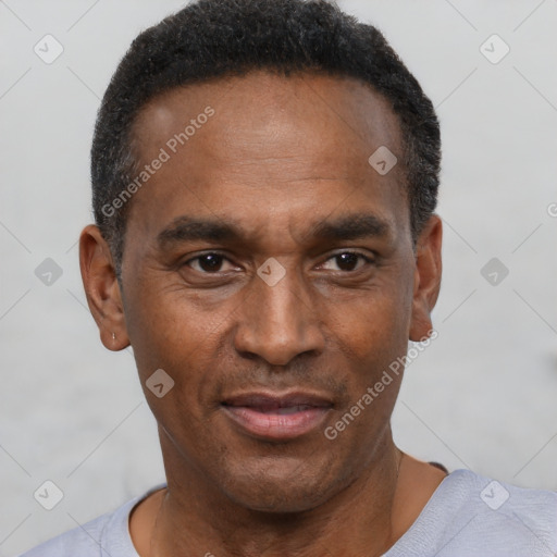 Neutral latino adult male with short  black hair and brown eyes