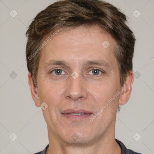 Joyful white adult male with short  brown hair and brown eyes