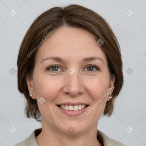 Joyful white adult female with medium  brown hair and grey eyes