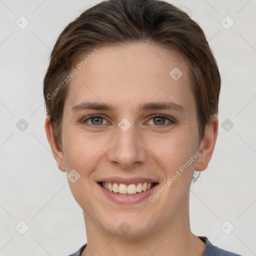 Joyful white young-adult female with short  brown hair and grey eyes