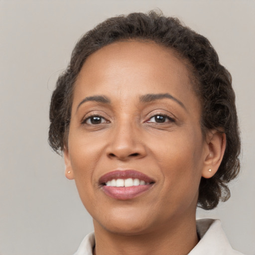 Joyful white adult female with short  brown hair and brown eyes