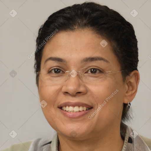 Joyful latino adult female with short  brown hair and brown eyes