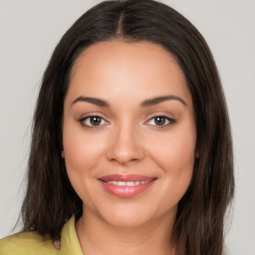 Joyful white young-adult female with long  brown hair and brown eyes