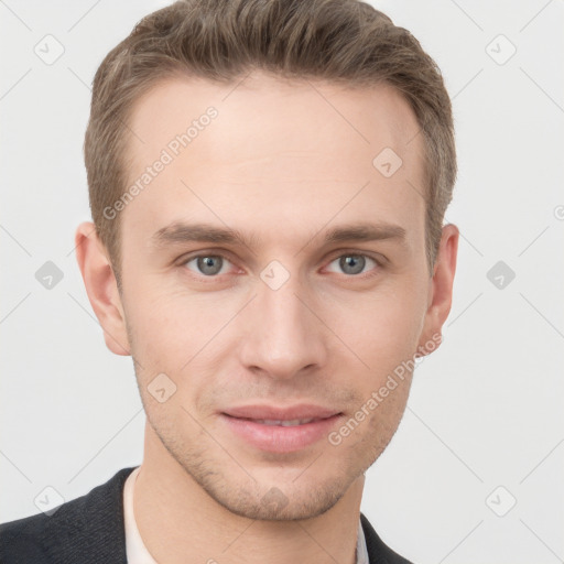 Joyful white young-adult male with short  brown hair and grey eyes