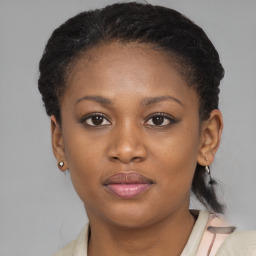 Joyful black young-adult female with short  brown hair and brown eyes