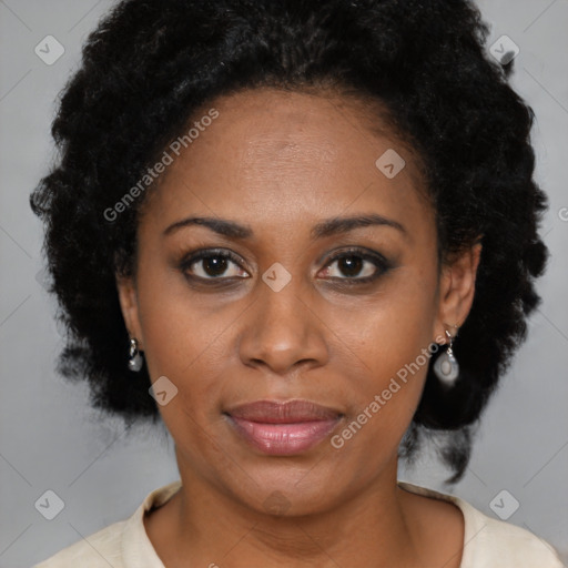 Joyful black adult female with short  brown hair and brown eyes