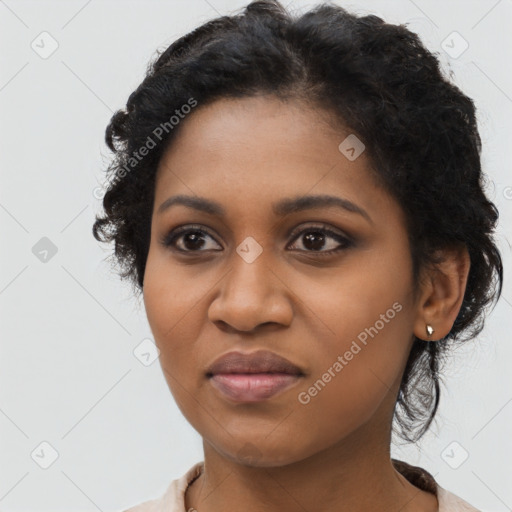 Joyful black young-adult female with medium  black hair and brown eyes