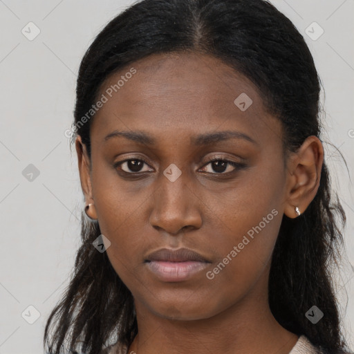 Neutral black young-adult female with long  brown hair and brown eyes