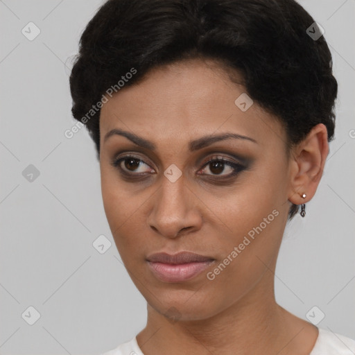 Joyful latino young-adult female with short  brown hair and brown eyes