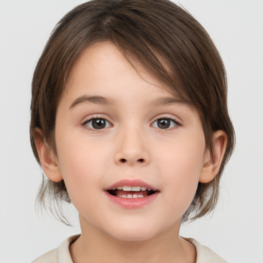 Joyful white child female with medium  brown hair and brown eyes