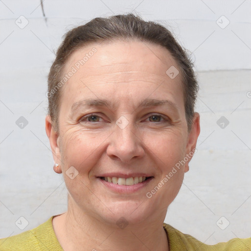 Joyful white adult female with short  brown hair and brown eyes