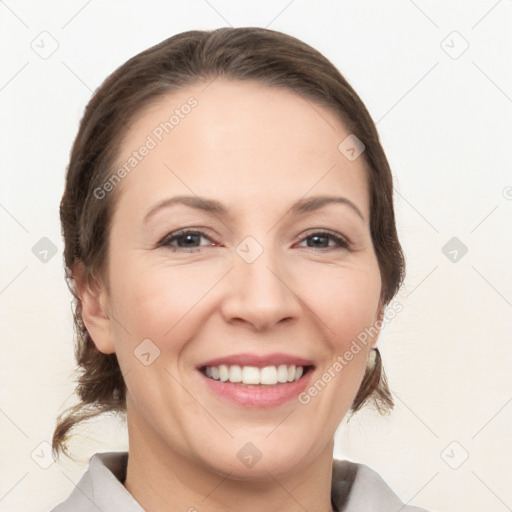 Joyful white adult female with medium  brown hair and brown eyes