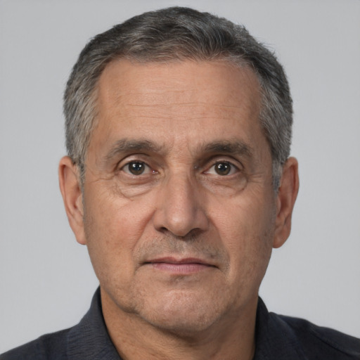 Neutral white middle-aged male with short  gray hair and brown eyes