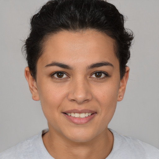 Joyful white young-adult female with short  brown hair and brown eyes