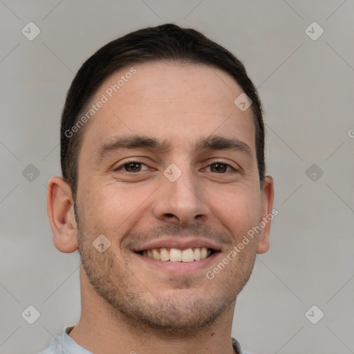 Joyful white young-adult male with short  brown hair and brown eyes