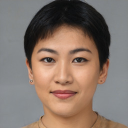 Joyful asian young-adult female with short  brown hair and brown eyes