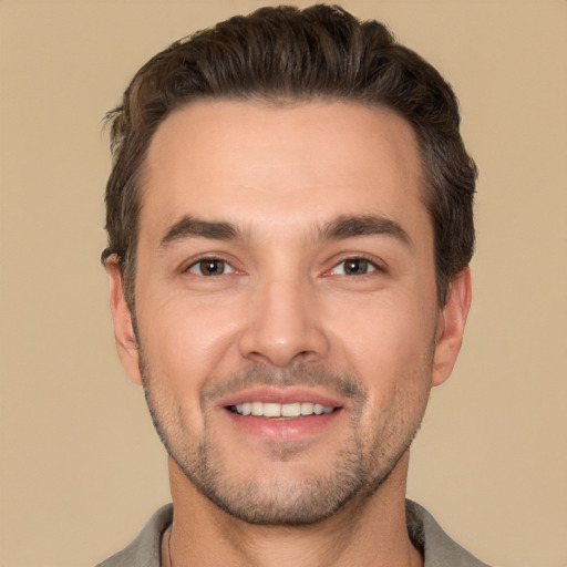 Joyful white young-adult male with short  brown hair and brown eyes