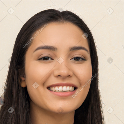 Joyful latino young-adult female with long  black hair and brown eyes